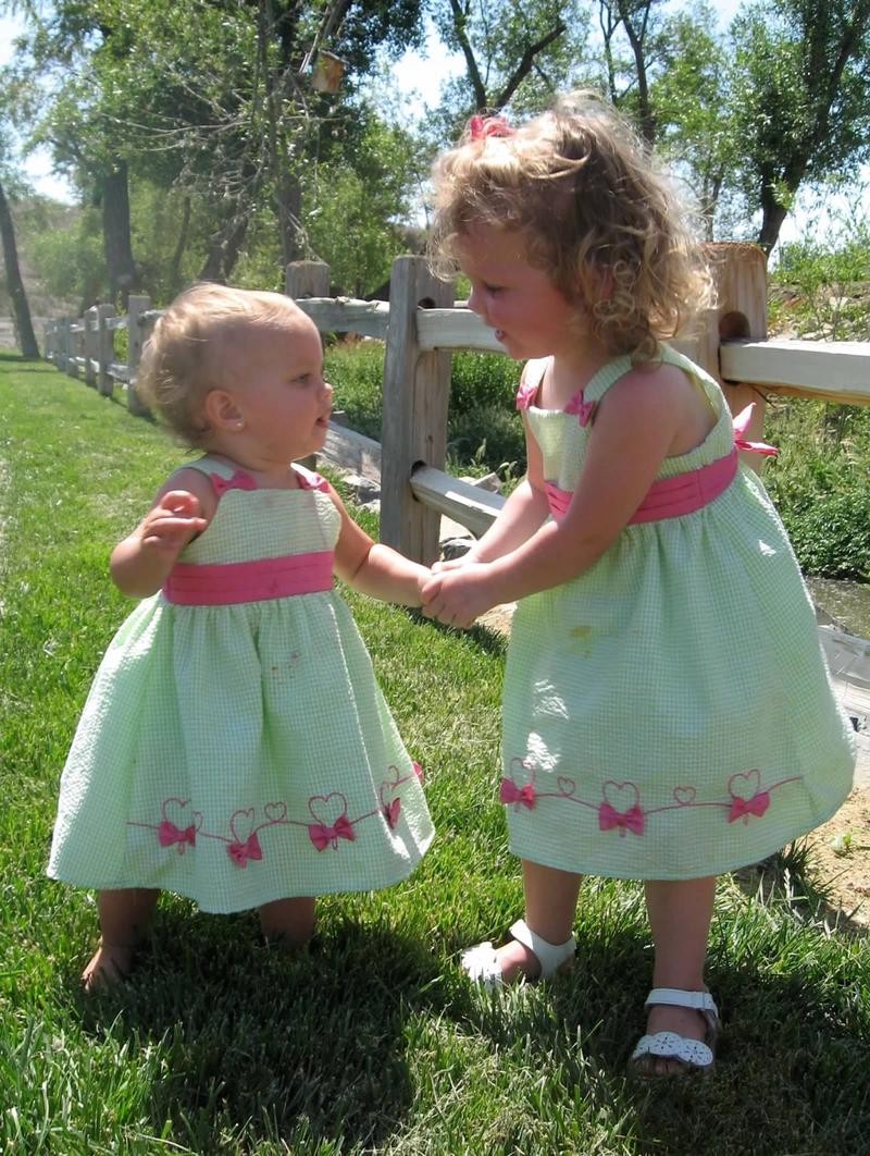 Connie's daughters as little girls in matching dresses